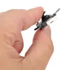 A hand holding a small electronic component. Podgląd zdjęcia produktu