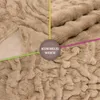 A close-up of a textured beige blanket, with colored lines pointing to a central circle containing text. Produktbild-Vorschau