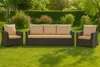 Outdoor furniture set on a green lawn with bushes and trees in the background. Produktbild-Vorschau