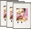 Three framed pictures of a woman holding macarons, with text indicating size and brand. Produktbild-Vorschau