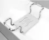 A bath seat is placed across the edge of a bathtub. Produktbild-Vorschau
