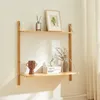 A wooden wall shelf with decorative items on it. Voir les images du produit