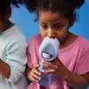 Two young girls are drinking from B.Box bottles. Voir les images du produit