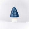 A blue mushroom-shaped lamp with a white base, set against a plain white background. Produktbild-Vorschau