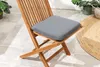 A wooden garden chair with a gray cushion on a tiled patio. Produktbild-Vorschau