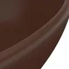 A close-up view of the rim of a dark brown ceramic oval washbasin. Podgląd zdjęcia produktu