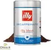 A can of illy coffee with some coffee grounds in front of it. Produktbild-Vorschau