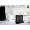 A desk scene with a laptop, a mug of coffee, and two power banks charging on a dock. Produktbild-Vorschau