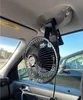 A close-up view of a portable car fan attached to the ceiling of a car. Anteprima dell’immagine prodotto