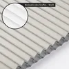 Close-up view of a folded white pleated blind, showing the texture and pleats. Produktbild-Vorschau