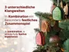 Christmas tree ornaments hanging on a decorated Christmas tree with bokeh lights in the background. Produktbild-Vorschau