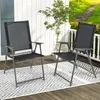Two black folding garden chairs are placed on a wooden deck with a patterned rug underneath. Náhľad obrázku produktu