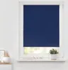 A dark blue roller blind is shown covering most of a window. The window frame is white. On the windowsill below the blind are a few decorative items and a potted plant. Produktbild-Vorschau
