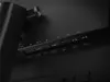 A close-up view of the ports on the back of a black monitor. Produktbild-Vorschau