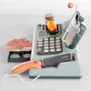 A toy cash register with accessories on a white background. Produktbild-Vorschau