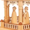 A close-up view of a wooden Christmas pyramid with carved figures. Produktbild-Vorschau