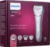The image shows the retail packaging of a Philips epilator, displaying the product and its accessories. Podgląd zdjęcia produktu