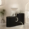 A modern reception desk in a store or office setting. Produktbild-Vorschau
