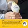 A close-up of a person's hand holding a Medela breast pump. Podgląd zdjęcia produktu