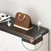 A close-up view of a shoe cabinet with a handbag on top, highlighting the cushion's thickness. Anteprima dell’immagine prodotto