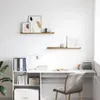 A clean, modern home office setup with a desk, chair, and shelves. Produktbild-Vorschau