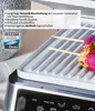 Close-up of a grill with food on it, with marketing text and logos. Produktbild-Vorschau
