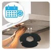 A person's hands are installing a filter into a kitchen range hood. Produktbild-Vorschau