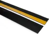 Two black strips with yellow adhesive tape on one side, lying diagonally on a white background. Produktbild-Vorschau