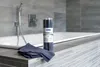 A bathroom setting with a bathtub and cleaning supplies. Produktbild-Vorschau
