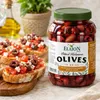 Elaion Kalamata Oliven Glas mit Bruschetta im Hintergrund Produktbild-Vorschau