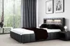 A modern bedroom with a large bed, nightstand, and window view. Produktbild-Vorschau