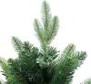 Close-up of the top of a green artificial Christmas tree with white background. Produktbild-Vorschau