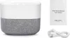 A white noise machine with its user manual and charging cable. Produktbild-Vorschau