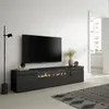 A modern living room with a TV stand featuring an electric fireplace, a large TV mounted above it, and a floor lamp. Produktbild-Vorschau