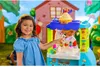 Two children playing with a Play-Doh ice cream truck toy in a backyard setting. Náhľad obrázku produktu