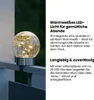 A close-up of a decorative solar light on a railing, with descriptive text. Produktbild-Vorschau