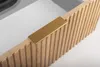 A close-up of a wooden cabinet drawer with a gold handle. Produktbild-Vorschau