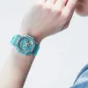 A person's wrist wearing a turquoise watch. Produktbild-Vorschau