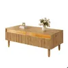 A wooden coffee table with gold accents and a vase of flowers on top. Produktbild-Vorschau