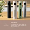 Four spray bottles of different colors are lined up on a wooden surface, with a blurred background of a kitchen counter and greenery. Anteprima dell’immagine prodotto