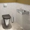 A modern bathroom with a toilet and sink. Anteprima dell’immagine prodotto