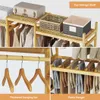 A collage of images showing a wooden garment rack with various clothing items and storage baskets. Produktbild-Vorschau