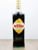 A bottle of Amaro Averna Siciliano on a wooden surface. Produktbild-Vorschau