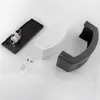 Disassembled parts of an outdoor wall light are laid out on a white surface. Anteprima dell’immagine prodotto