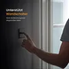 A person's hand is shown pressing a wall switch next to a doorway. Anteprima dell’immagine prodotto