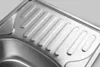 Close-up view of a stainless steel sink with a ribbed draining area. Produktbild-Vorschau