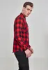 A man wearing a red and black checkered flannel shirt and black pants, shown from the side. Produktbild-Vorschau