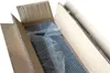 An open cardboard box with bubble wrap inside, showing a dark-colored product. Anteprima dell’immagine prodotto