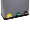 A close-up view of the bottom section of a gray trash can with three colored pedals. Produktbild-Vorschau