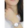 Close-up of a woman's wrist wearing a silver watch. Produktbild-Vorschau